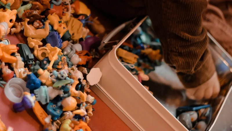 Open bins filled with mixed merchandise at a bin warehouse, shoppers browsing in background