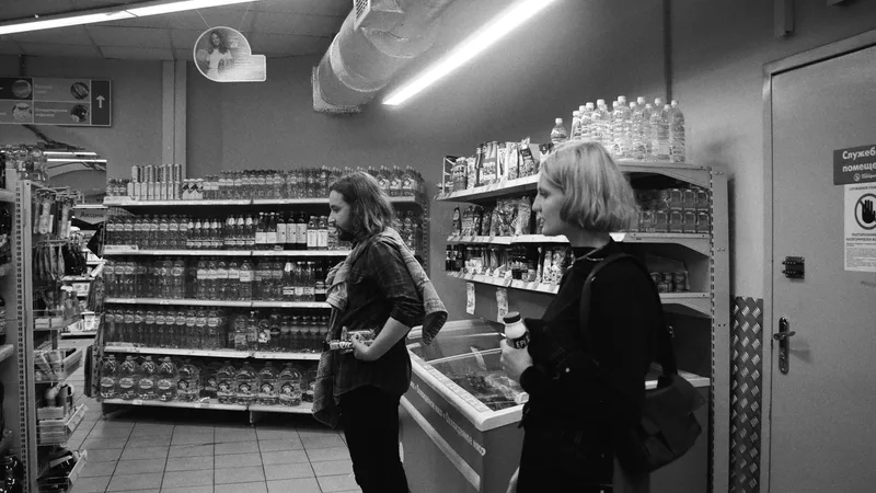 Shoppers sorting through bins of returned merchandise at a discount bin store