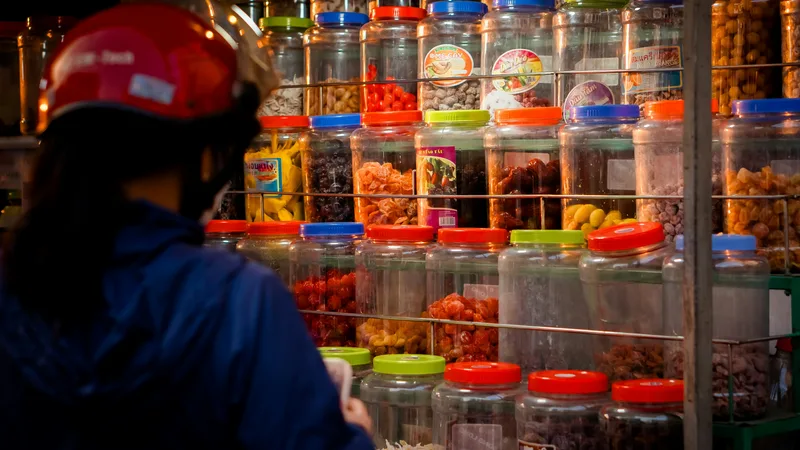 Bins filled with mixed merchandise including electronics, home goods, and toys at a bin warehouse liquidation store