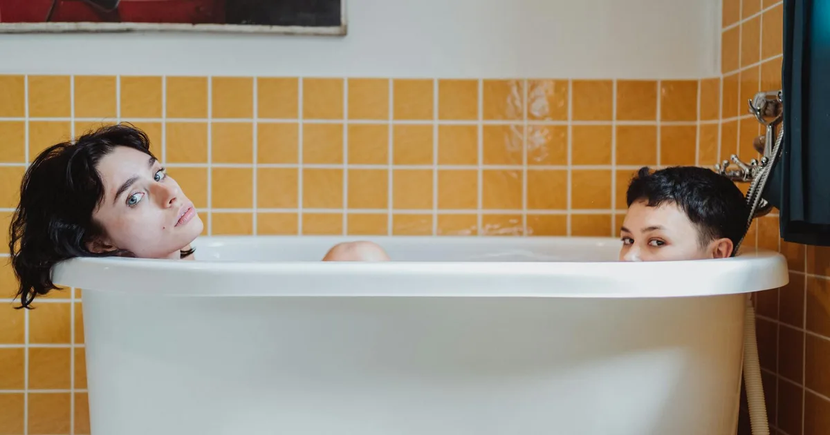 Two friends laughing while using a Cold Plunge Pal tub together