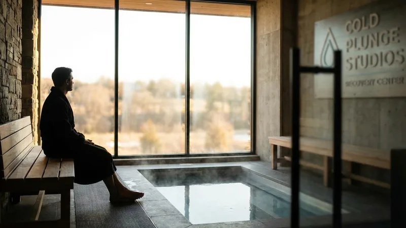 Interior of a contrast therapy studio showing hot and cold pool areas side by side