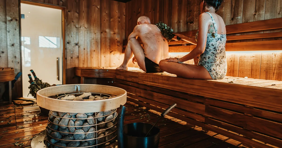 Individuals enjoying the Cold Plunge Pal experience in a bright indoor setting.
