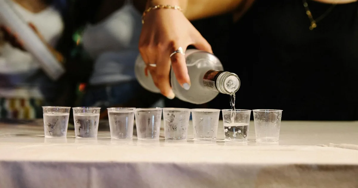 Customers tasting unique vodka at a Distillery Pal location.