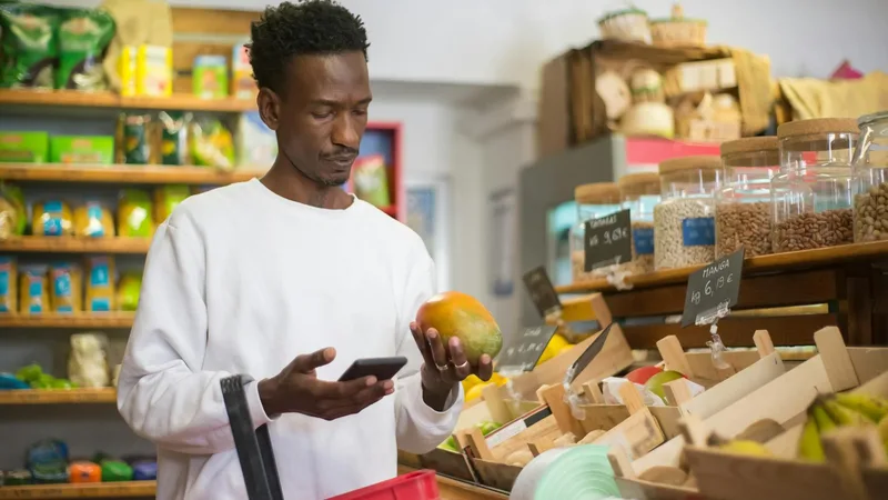 Interior of a dollar store showing cleaning supplies, snacks, and household items on shelves