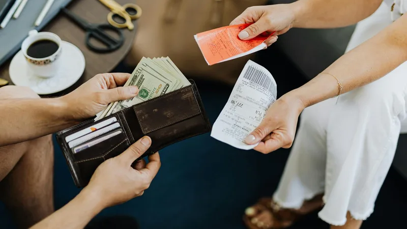 Shopper comparing prices at a discount variety store and thrift store