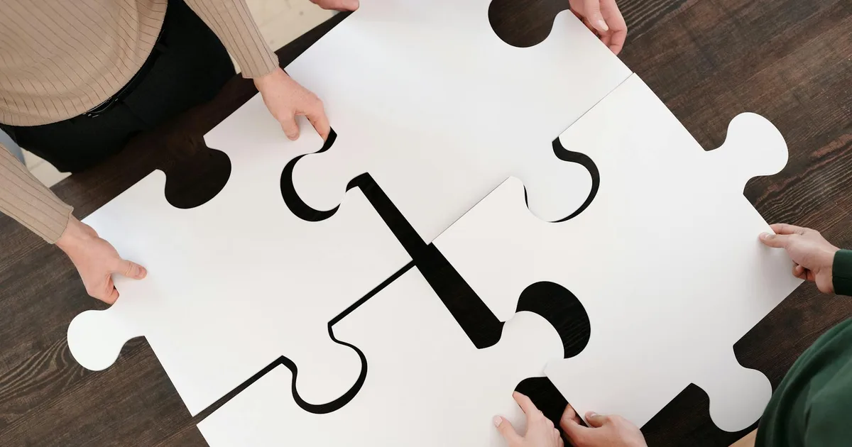 Group of friends engaged in an Escape Room Pal experience, solving puzzles.