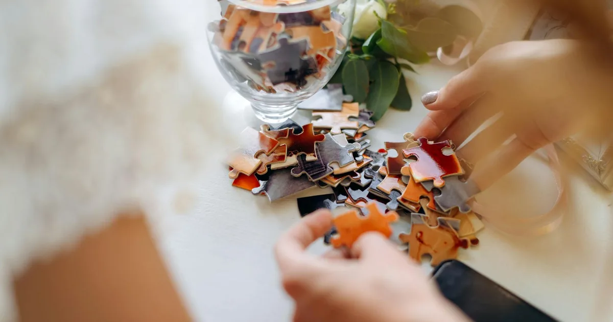 Group of friends working together to solve puzzles inside a themed escape room