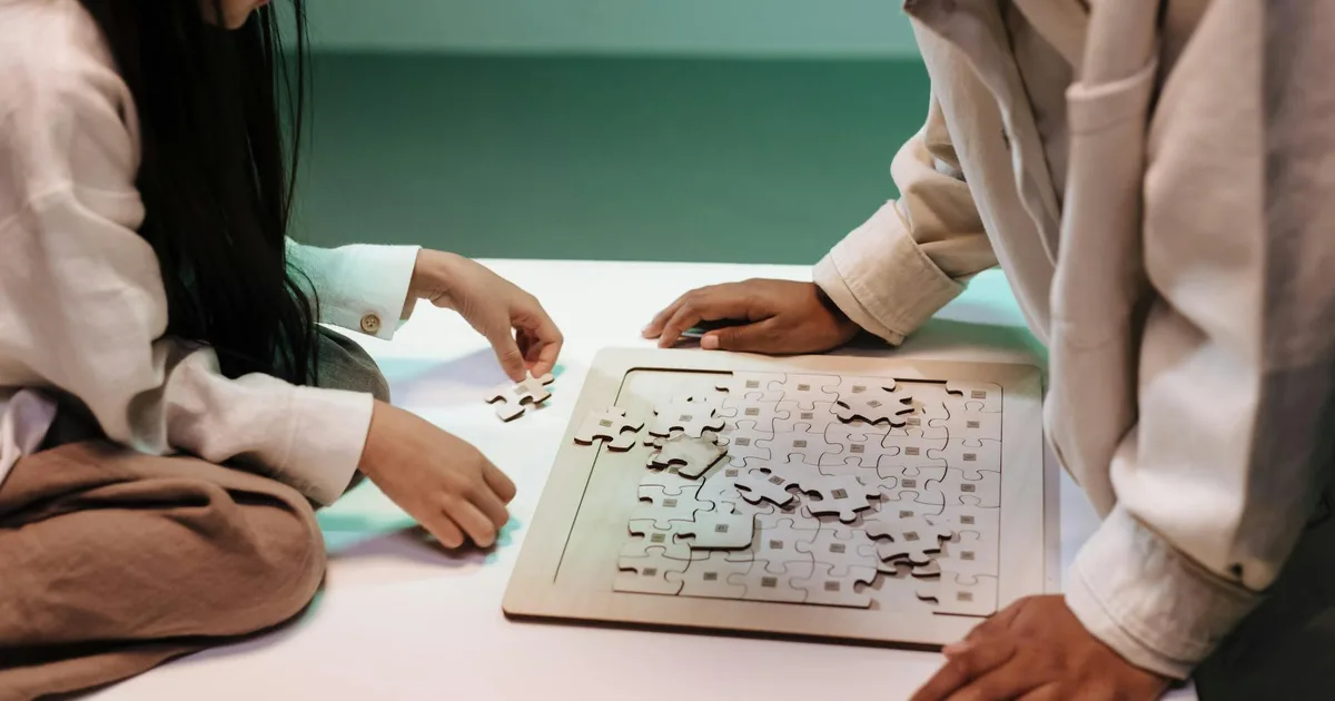 Group of friends solving puzzles inside a themed escape room