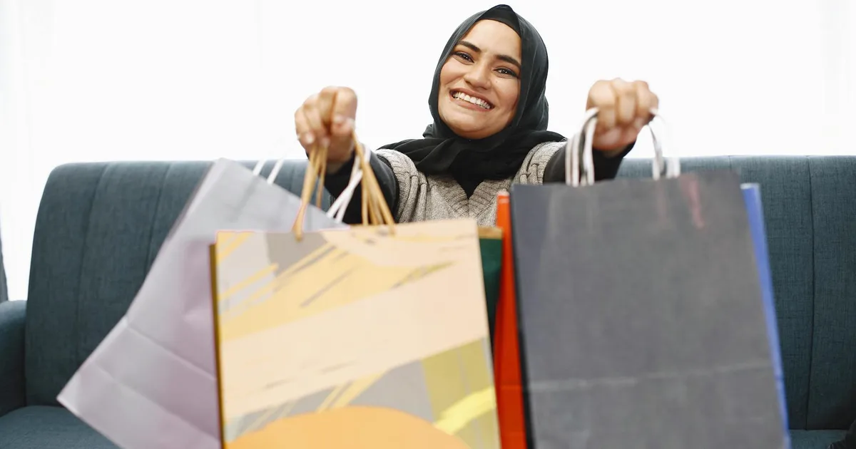 Shopper browsing a liquidation store aisle filled with discounted overstock merchandise