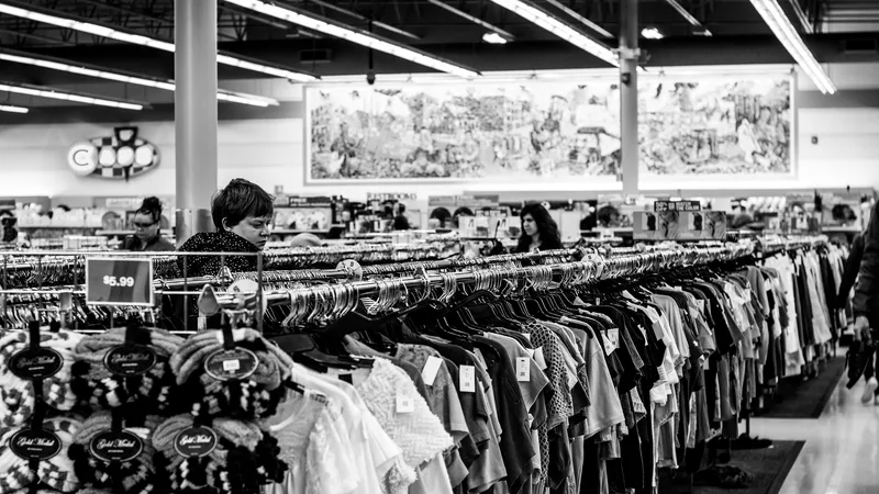 Organized shelves inside a liquidation store showing overstock electronics, home goods, and clothing at discounted prices