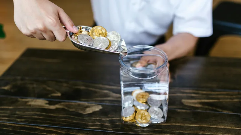 Jeweler using electronic testing equipment to assess gold purity at a pawn shop counter
