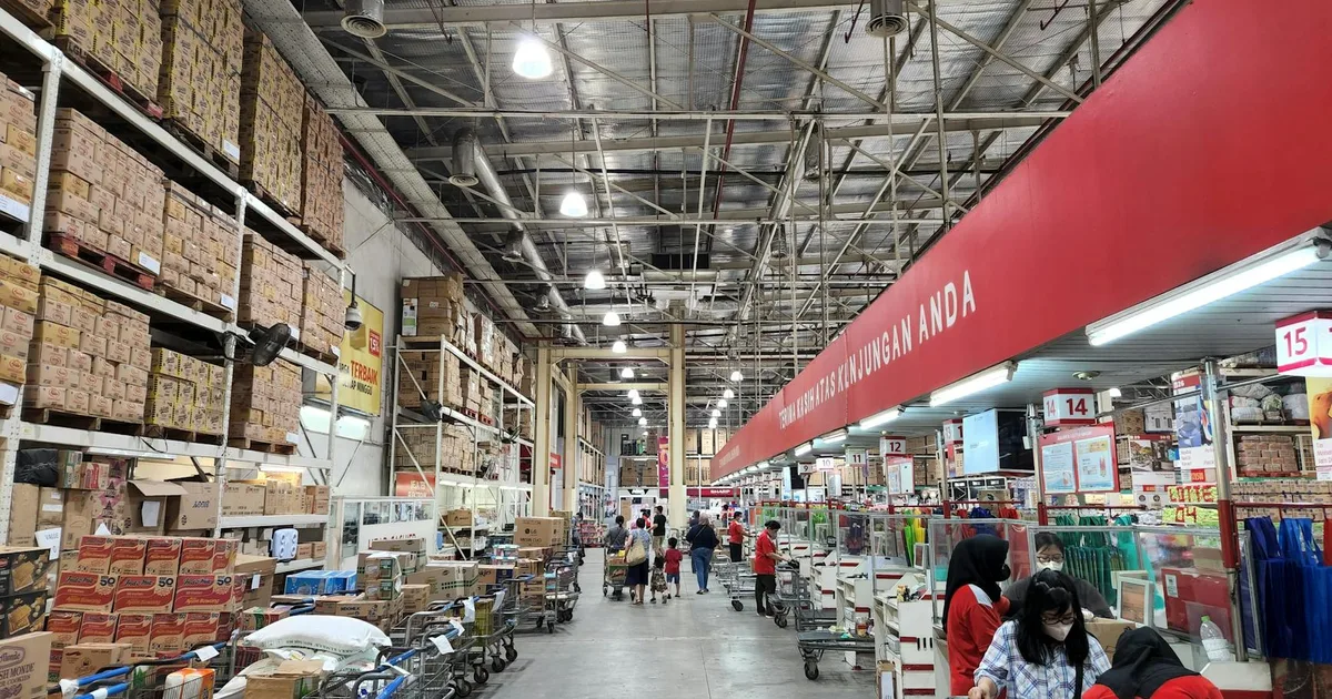Customer shopping in American supermarket, exploring options at Salvage Grocery Stores