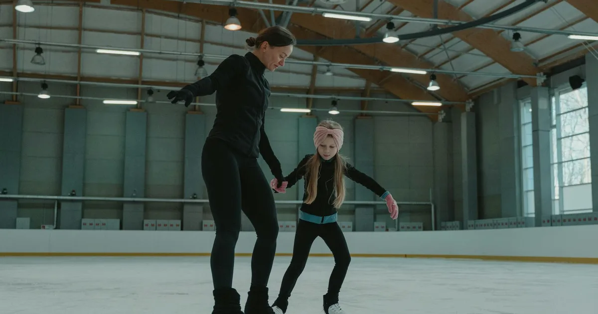 A family enjoying ice skating at a Skating Rink Pal facility