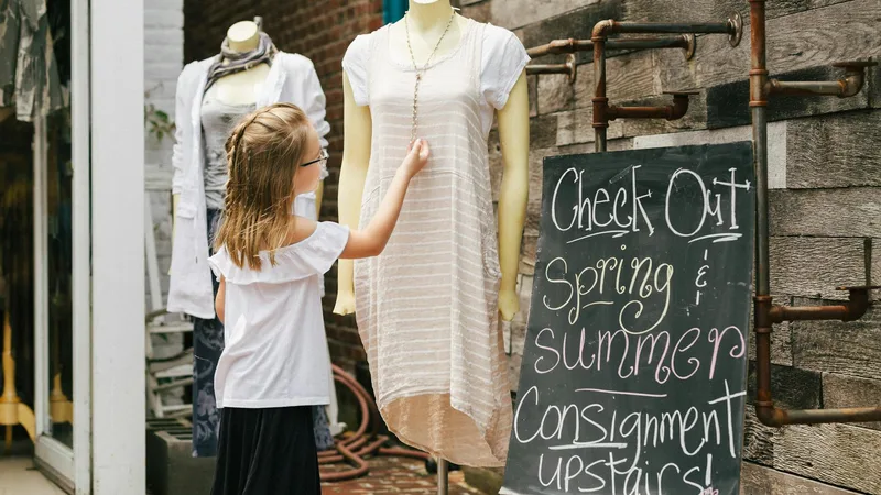 Family enjoying their time with Thrift Store Pal while choosing clothes