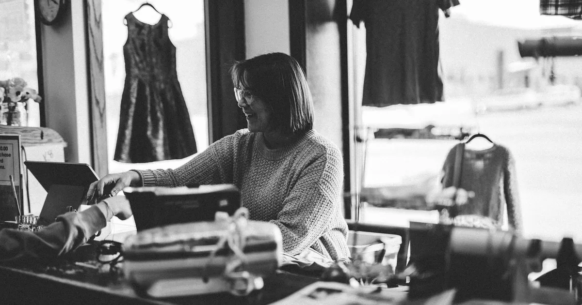 Group of friends exploring thrift store finds for Thrift Store Pal
