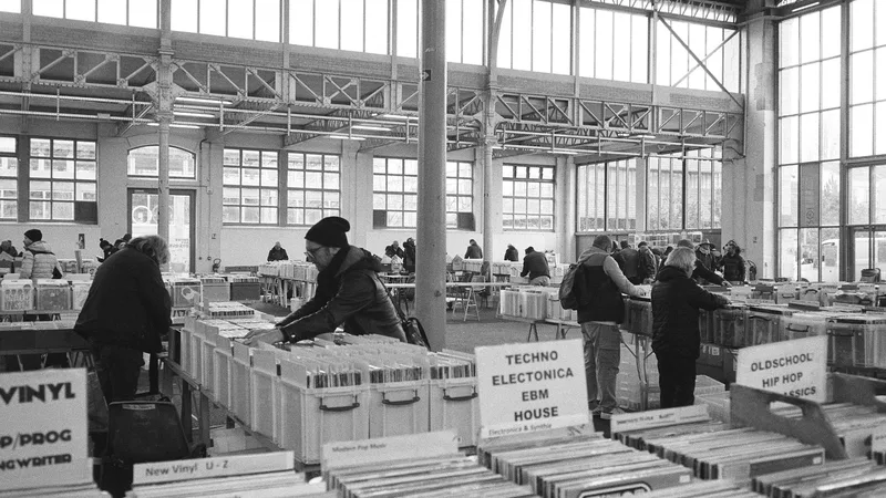 Customers actively engaging with products at Thrift Store Pal, searching for great finds.