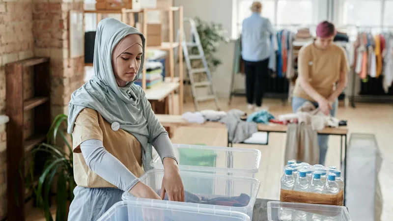 Shoppers exploring clothing options at Thrift Store Pal for great deals